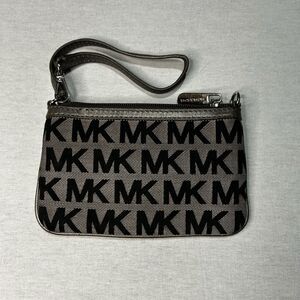 Michael Kors Jet Set wristlet in the Signature logo print